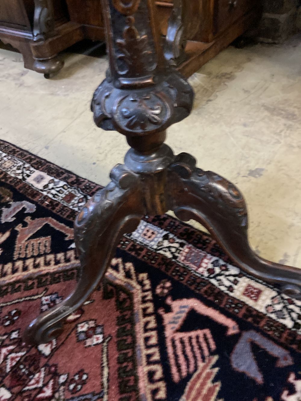 A Victorian carved walnut tripod wine table, diameter 44cm height 72cm